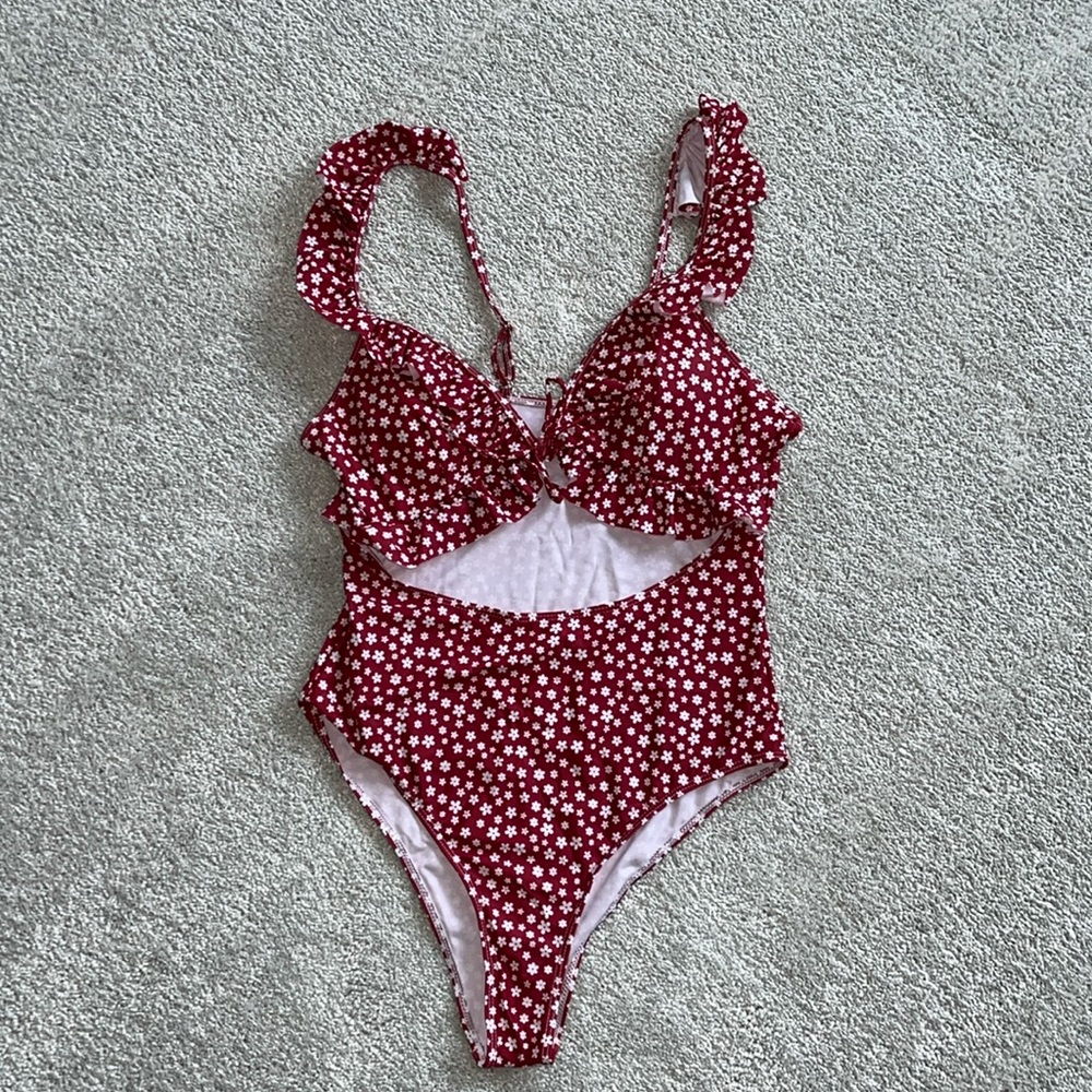 One piece swimsuit with ruffles and front cutout